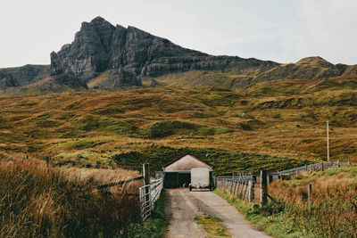 Scenic view of landscape and mountains against sky