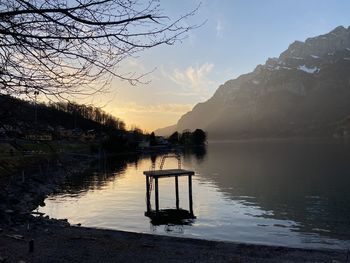 Scenic view of lake against sky during sunset