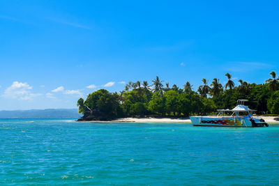 Scenic view of sea against blue sky