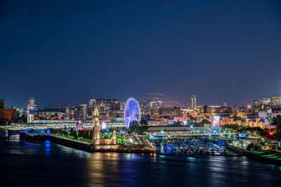 Illuminated buildings in city at night