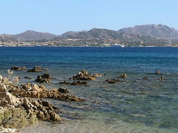 Scenic view of sea against clear blue sky