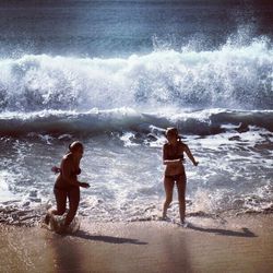 Woman jumping on beach