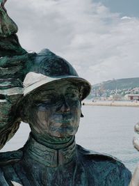 Close-up of statue against sky