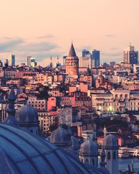 High angle view of city buildings at sunset