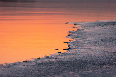 Frozen serenity. winter's icy embrace on the river in northern europe