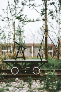 Abandoned vintage car on field against sky