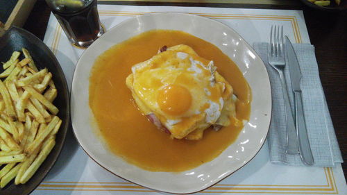 Close-up of fried egg served in plate on table