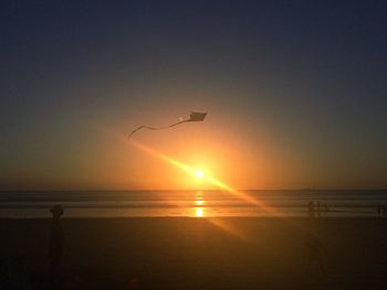 Scenic view of sea at sunset