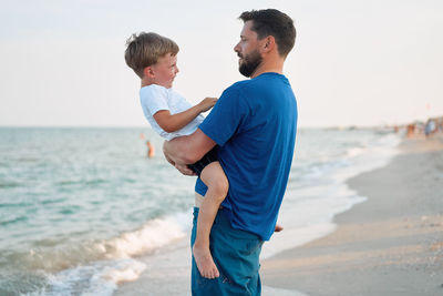 Father and son on beach