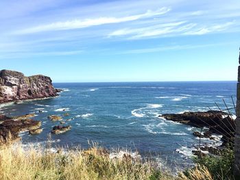 Scenic view of sea against blue sky