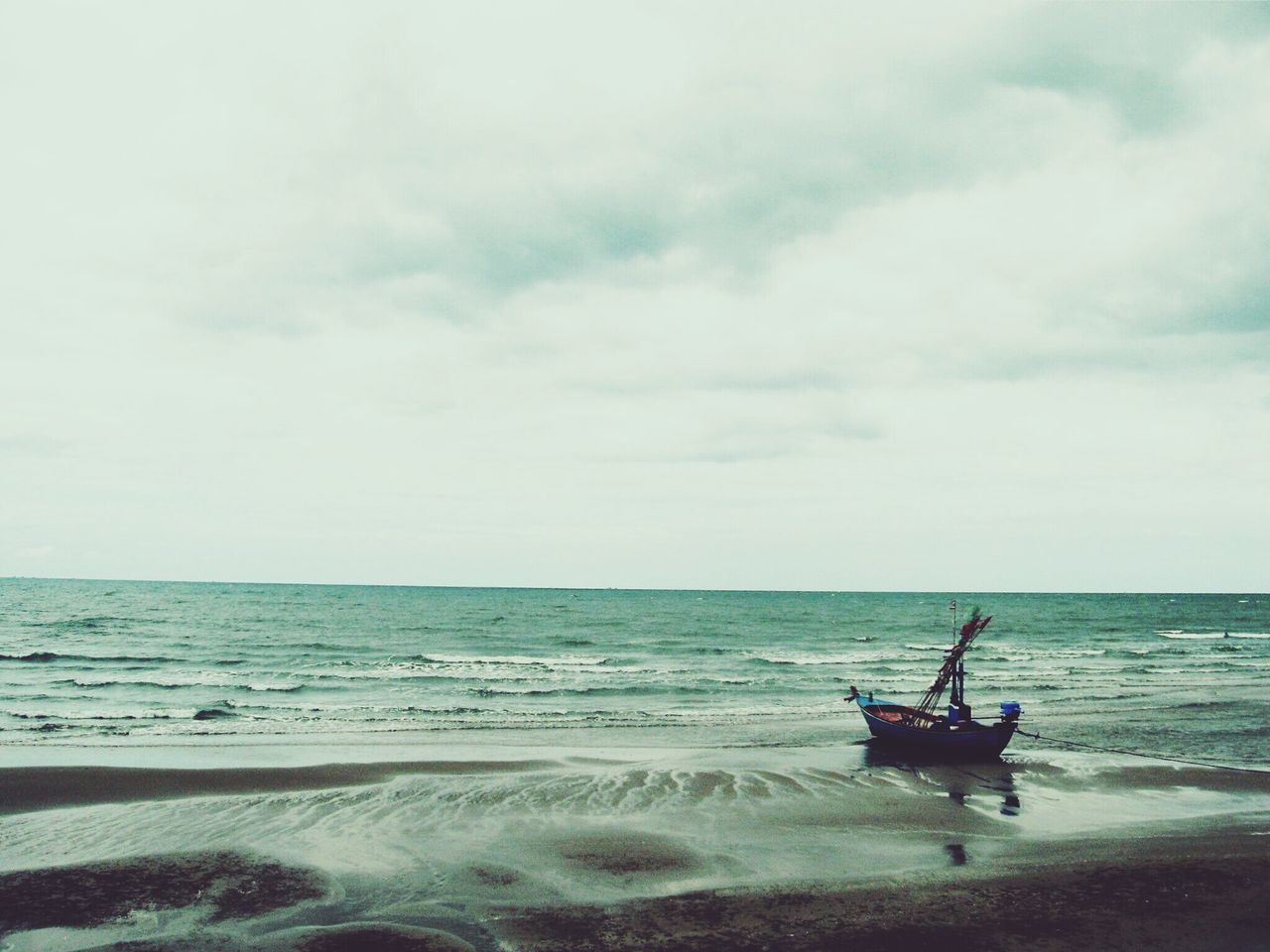 sea, water, horizon over water, nautical vessel, sky, transportation, mode of transport, boat, beach, cloud - sky, scenics, shore, men, tranquility, nature, tranquil scene, beauty in nature, leisure activity, lifestyles