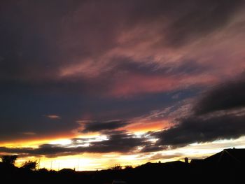 Silhouette of landscape against dramatic sky