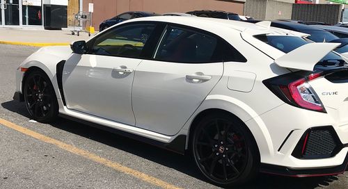 Side view of car parked on road