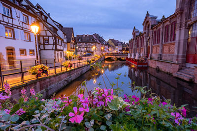 View of canal amidst buildings