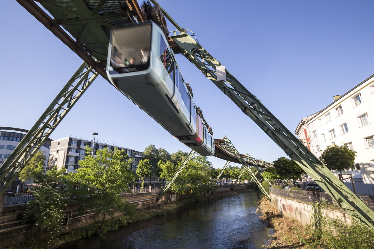 LOW ANGLE VIEW OF BRIDGE OVER RIVER