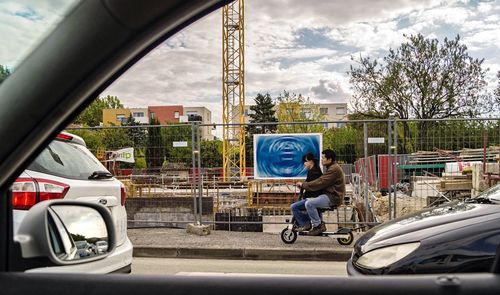 Directly above shot of man riding car on road