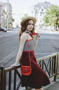 Portrait of young, happy, elegant redhead curly woman, girl in hat, casual clothes. french style. 