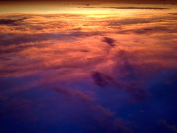 Scenic view of dramatic sky at sunset