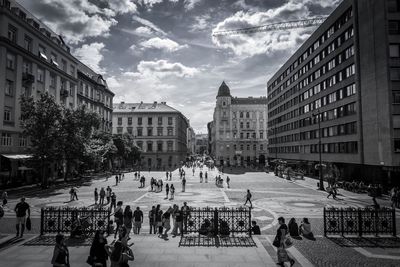 People in city against clear sky