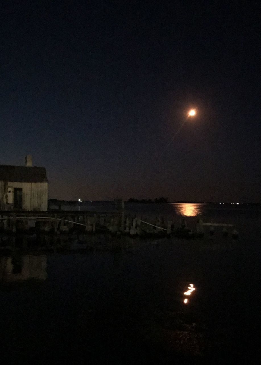 VIEW OF SEA AGAINST SKY AT NIGHT