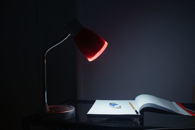 Close-up of electric lamp on table