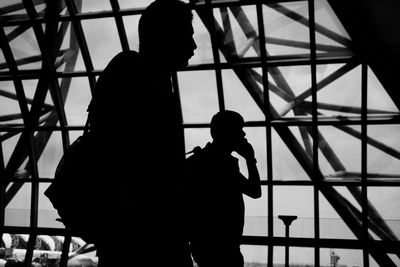 Silhouette of people in modern building