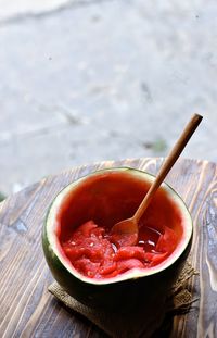 Close-up of watermelon soup in watermelon bowl on table