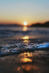 Scenic view of sea against clear sky during sunset