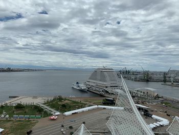 High angle view of city against cloudy sky