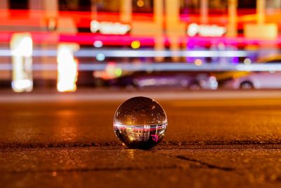 Close-up of crystal ball on street 