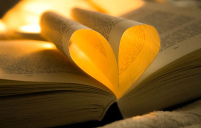 Close-up of heart shape on book