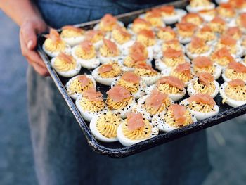 High angle view of person preparing food on tray