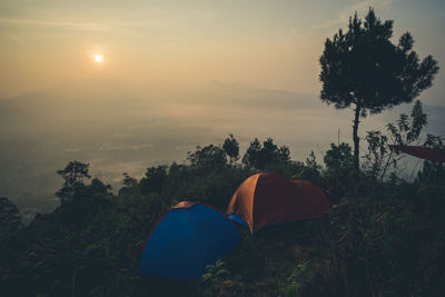 Tent against sky during sunset