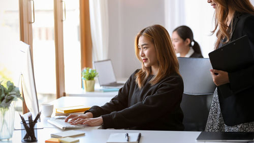 Female business colleagues working at office