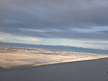 Scenic view of landscape against sky during winter