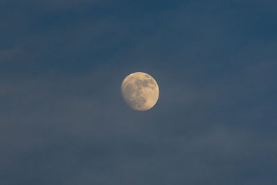 Low angle view of moon against sky at night