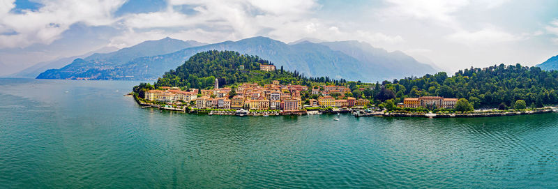 Panoramic view of townscape by sea against sky