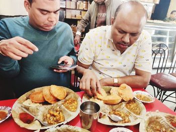 Midsection of man having food