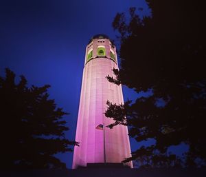 Low angle view of tower against sky at night