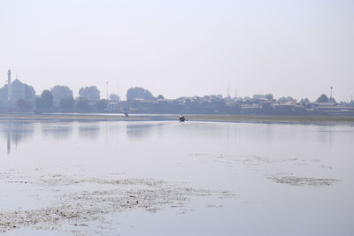 Scenic view of lake against clear sky