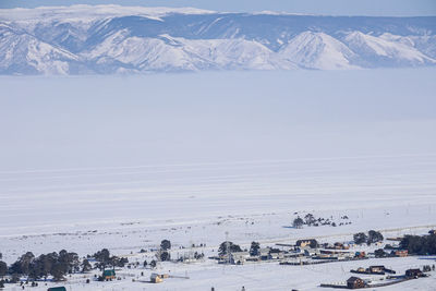 Scenic view of snow covered mountains against sky