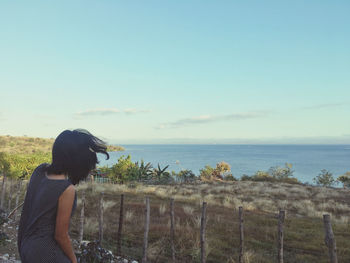 Man looking at sea against sky