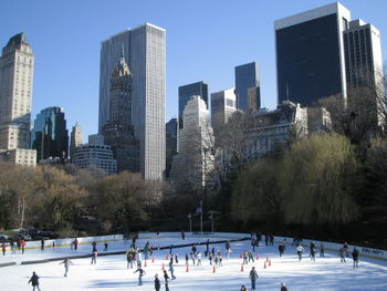 High angle view of people ice-skating at central park during winter