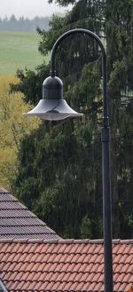 House roof and trees by building