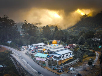 High angle view of cars on road against sky during sunset