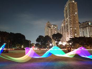 Illuminated buildings in city at night