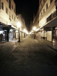 Illuminated street lights at night