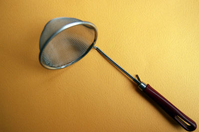 High angle view of camera on table against wall