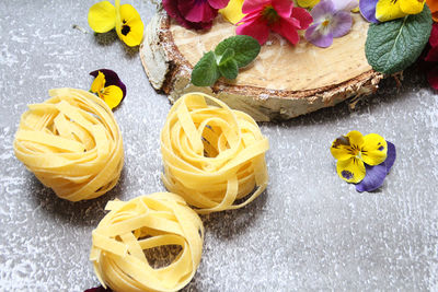 High angle view of yellow roses on table
