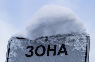 Close-up of snow on information board